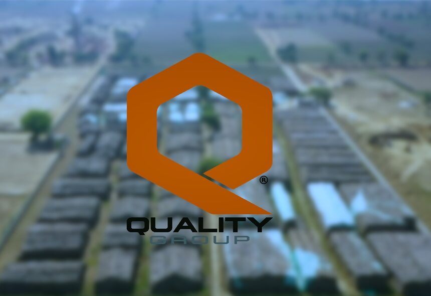warehouses of quality bio with their logo in front, their large warehousing proving why they are top Biomass Products Manufacturer in Haryana